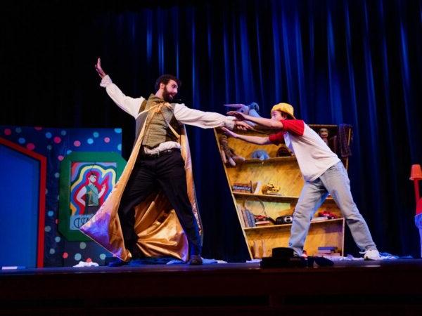 a man and woman performing on a stage